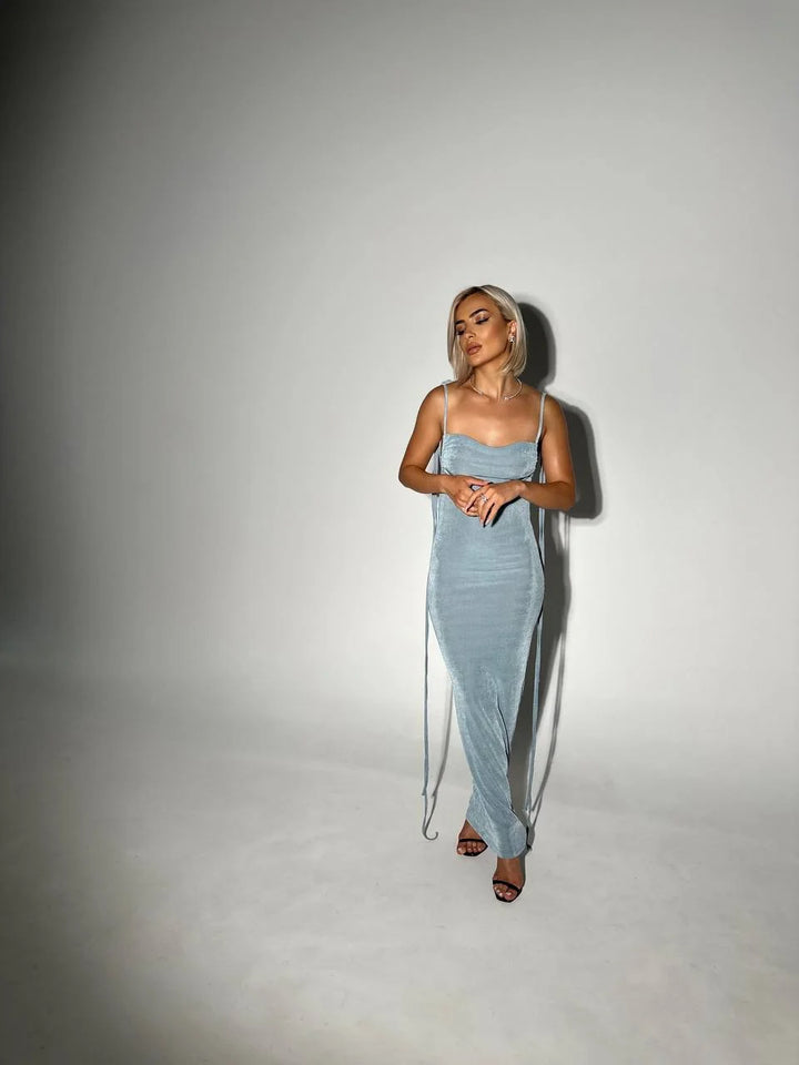 Alt text: Karmen backless dress in lightweight fabric with adjustable ties for a sleek look.