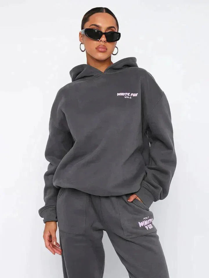 "Jaziah - Two-piece hoodie and pants set in soft, cozy fabric with a relaxed fit and drawstring waistband."