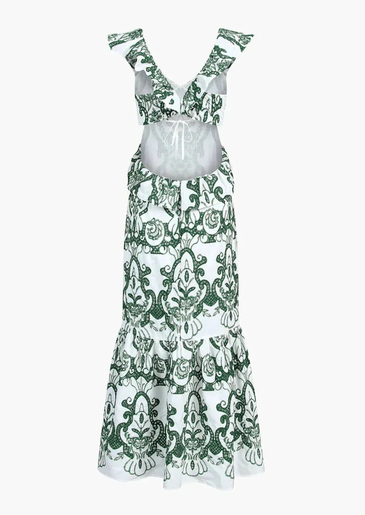 White and green ruffled maxi dress by Jaelani, showcasing a chic design with flowing silhouette and elegant color contrast.