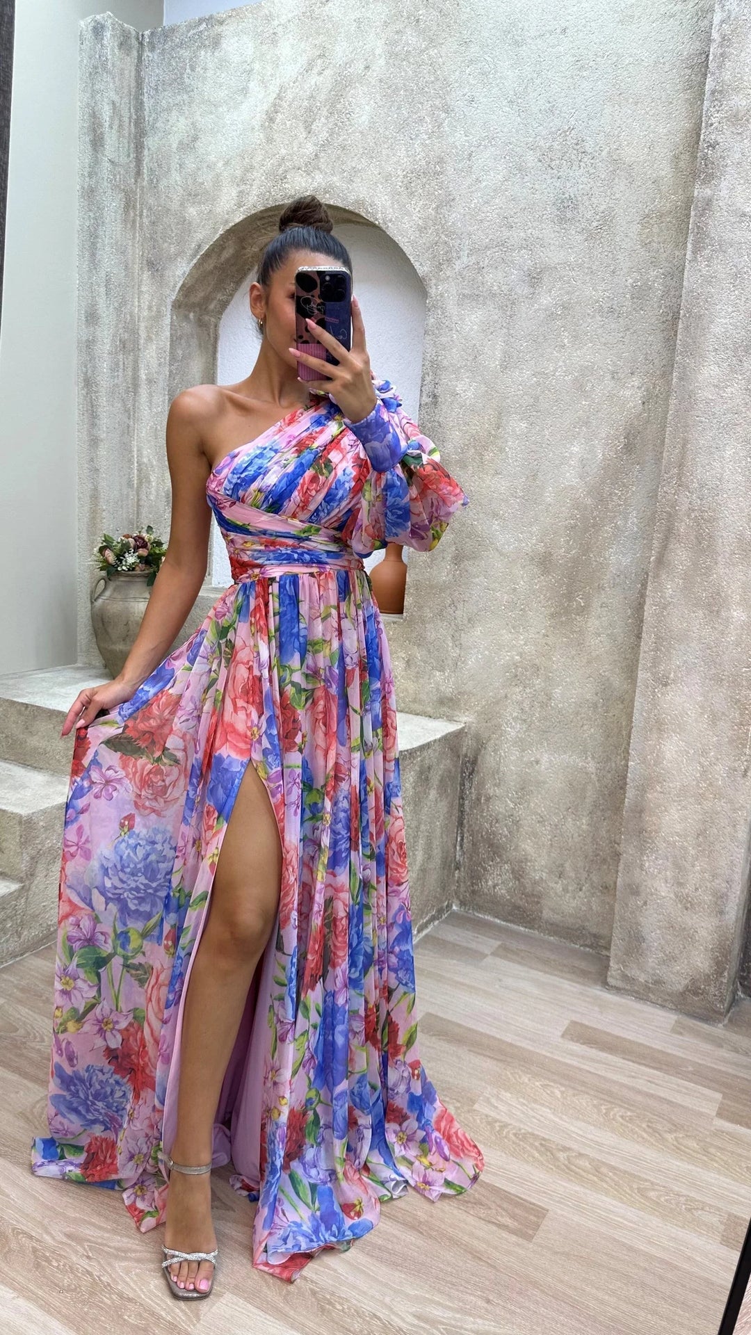 One-shoulder floral dress by Story featuring a flowy design with intricate floral patterns on soft, lightweight fabric.