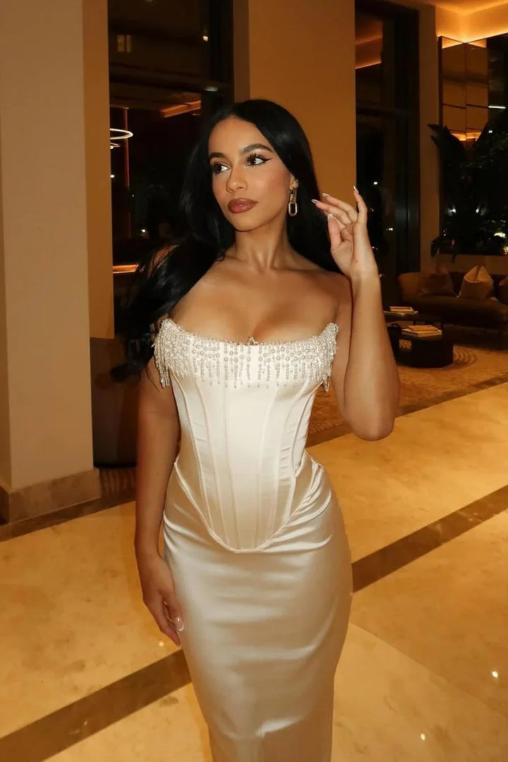 "Analiya ivory strapless midi dress featuring intricate bead detailing, perfect for a special occasion outfit."