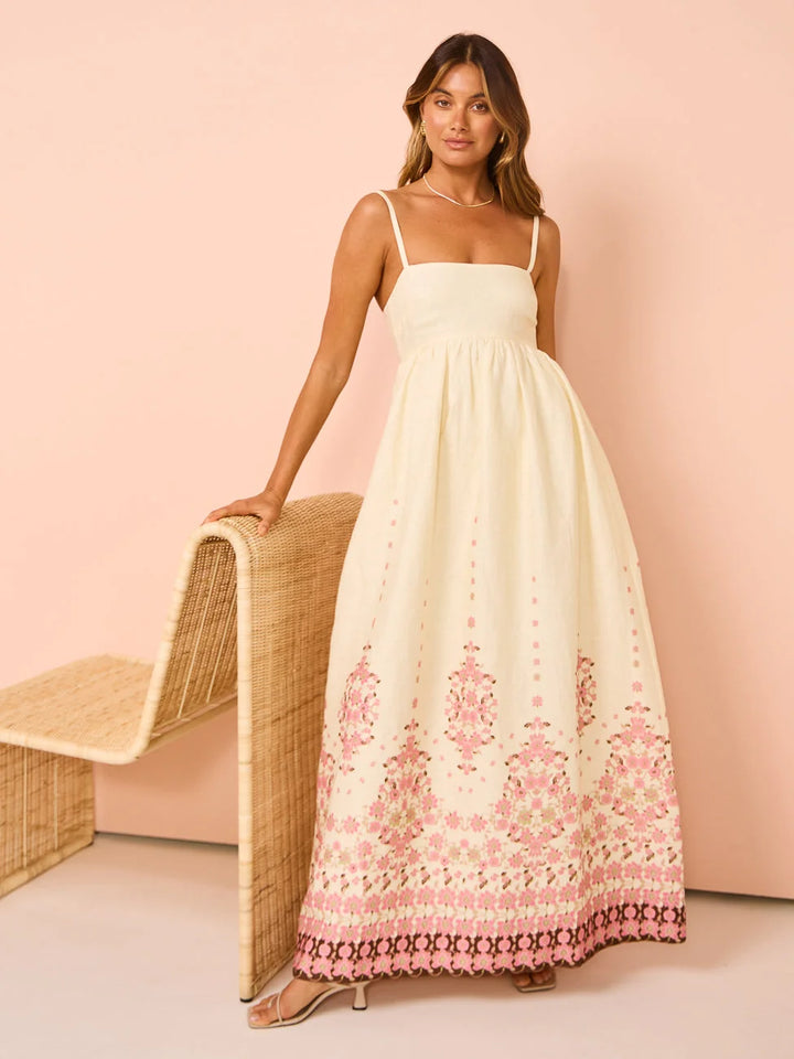 Cream maxi dress with floral embroidery, perfect for warm days. Features soft and comfortable fabric. Subtle, elegant design…