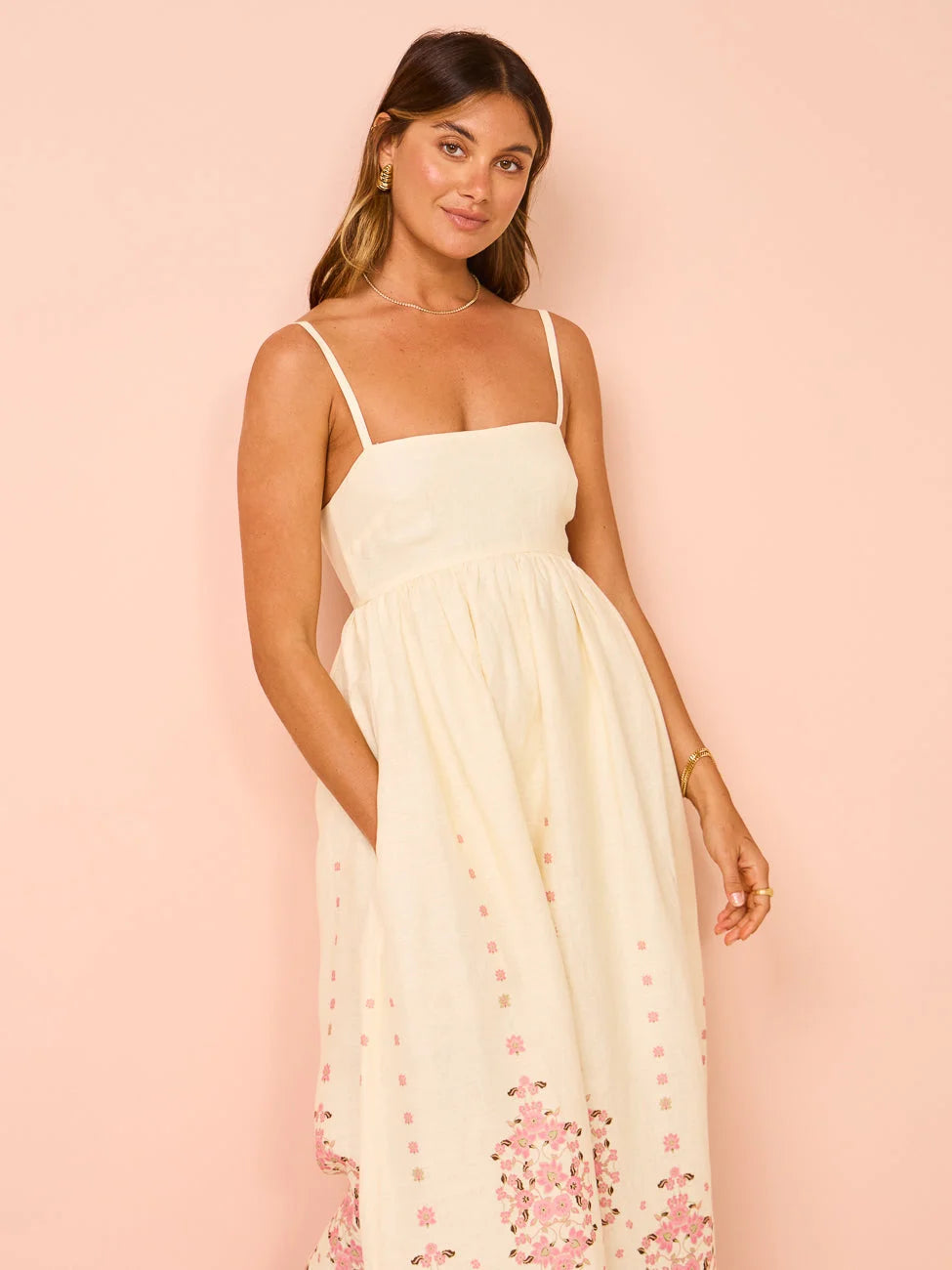 Cream maxi dress with intricate floral embroidery on the bodice and sleeves, made of soft and lightweight material in Cream…