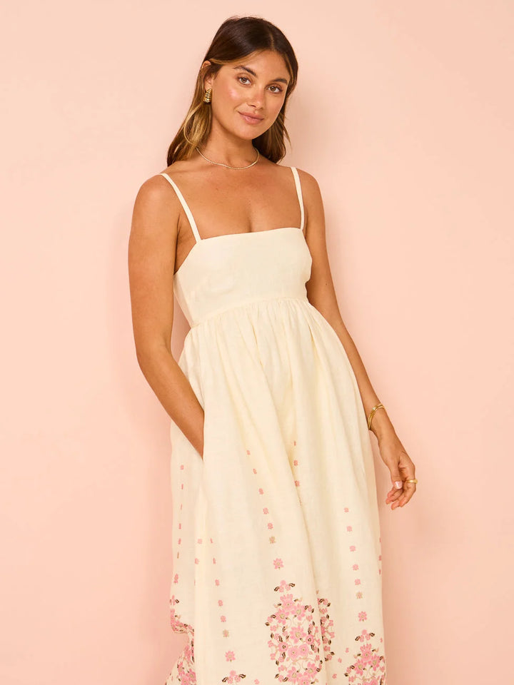 Cream maxi dress with intricate floral embroidery on the bodice and sleeves, made of soft and lightweight material in Cream…