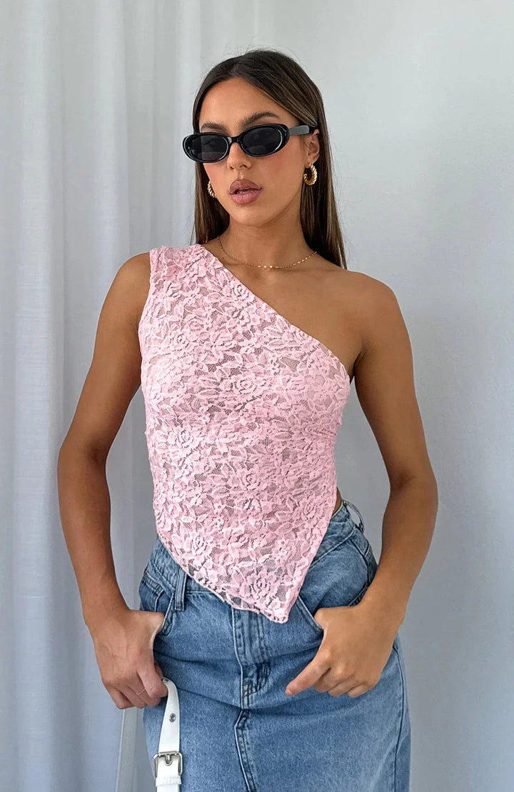 Pink halter top with lace texture for women by Shira. Feminine and elegant design perfect for casual outings or special…