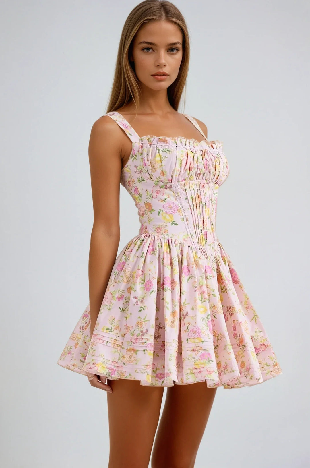 Pink floral mini dress with corset top featuring a charming floral print and structured bodice, perfect for a chic and…