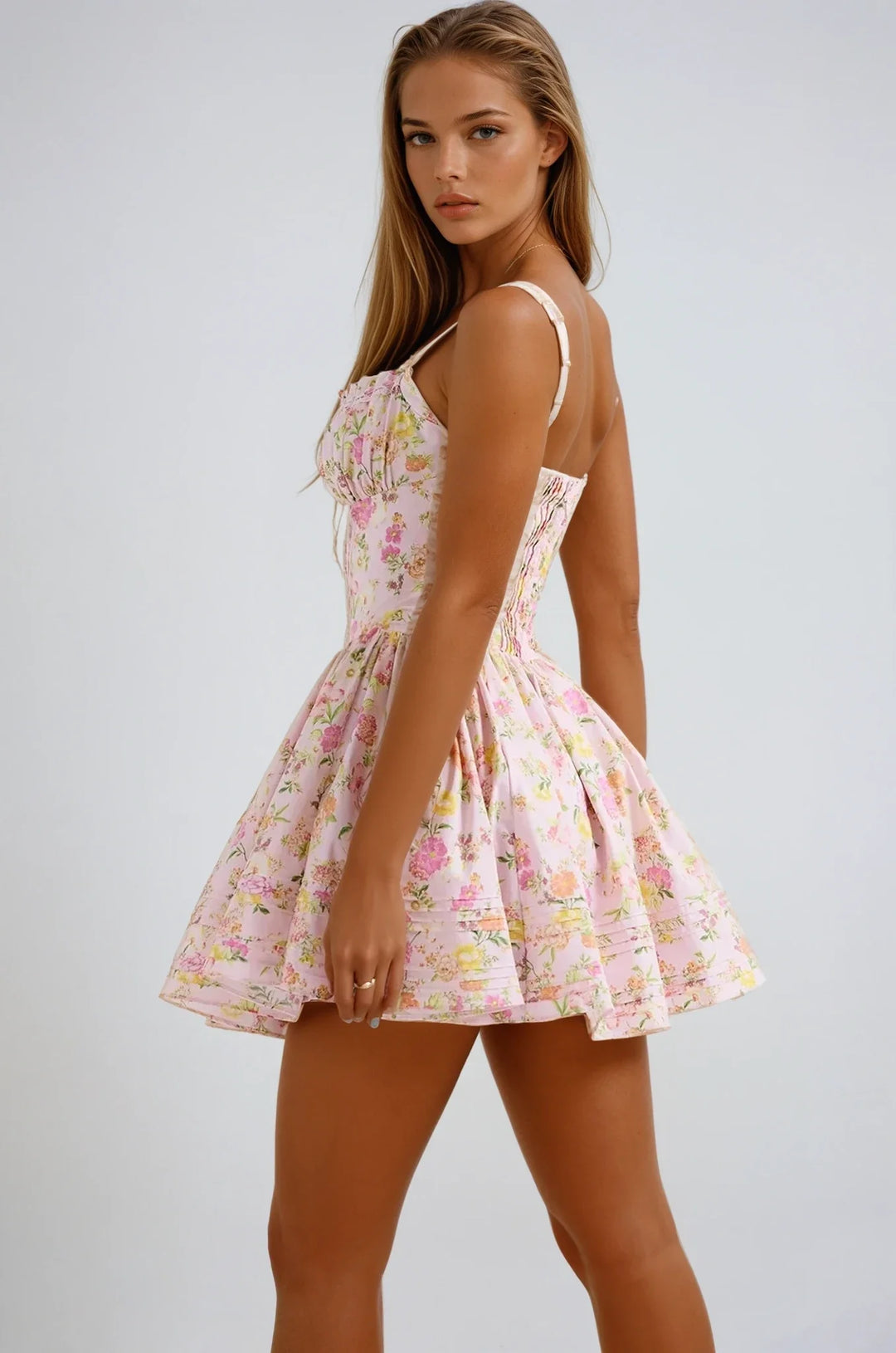 Pink floral mini dress with corset top, featuring a flattering silhouette and intricate floral design on a lightweight…