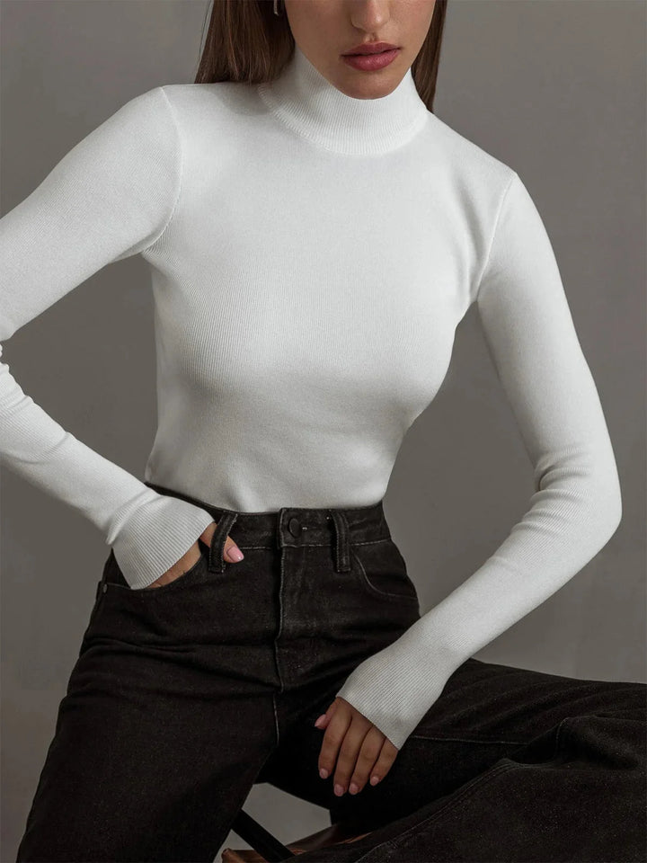 White seamless turtleneck made for versatile styling with a comfortable fit and sleek design by Kori.