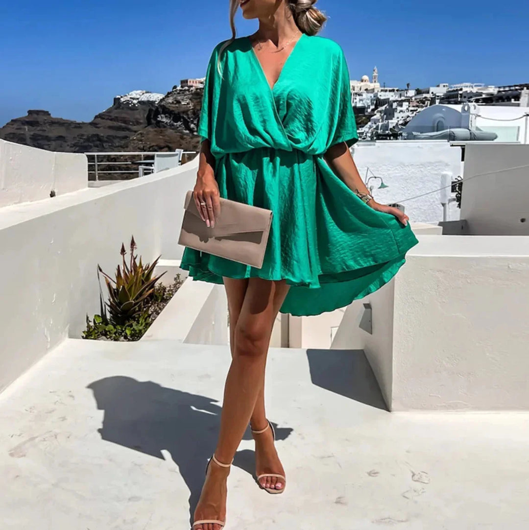 Amairany wrap mini dress in deep blue velvet with puff sleeves, ruched waist, and V-neck neckline for stylish and chic look.