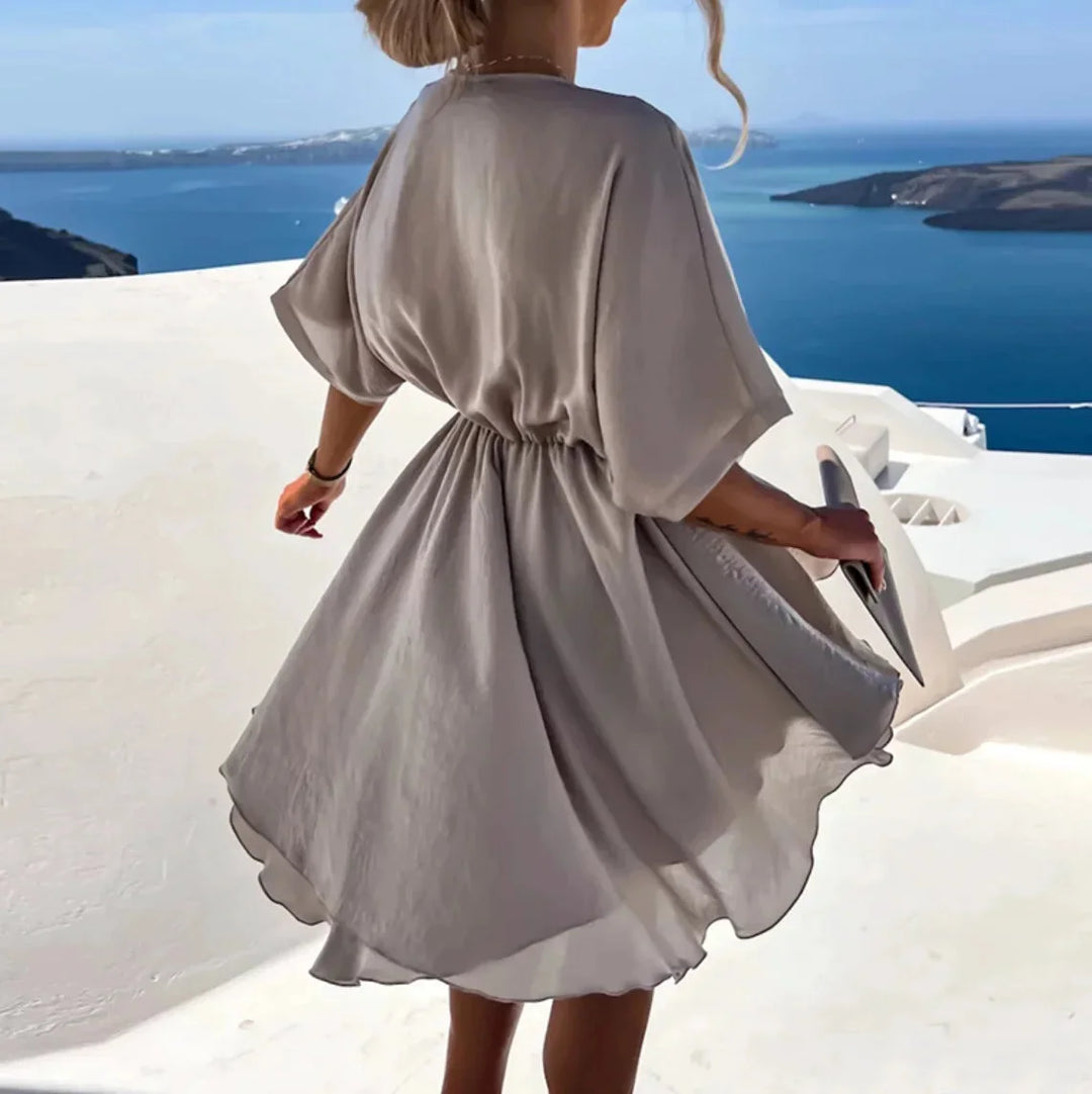 Amairany - Elegant wrap mini dress in silky satin fabric with a deep V-neckline and flowing skirt, perfect for a chic…