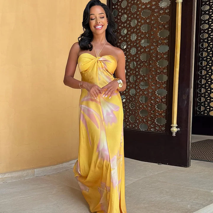 "Clare - Strapless yellow floral maxi dress with a breezy design perfect for summer, featuring a vibrant print and flowy…