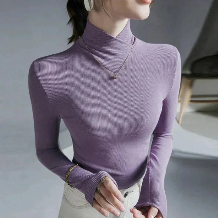 "Rylei Seamless slim-fit high-collar top in Purple, made with stretchy and breathable fabric. Unique seamless design for a…