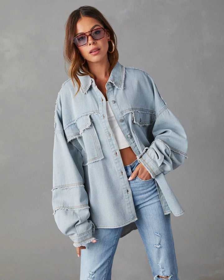 Blue cotton blouse with chest pockets, casual and versatile design for everyday wear.