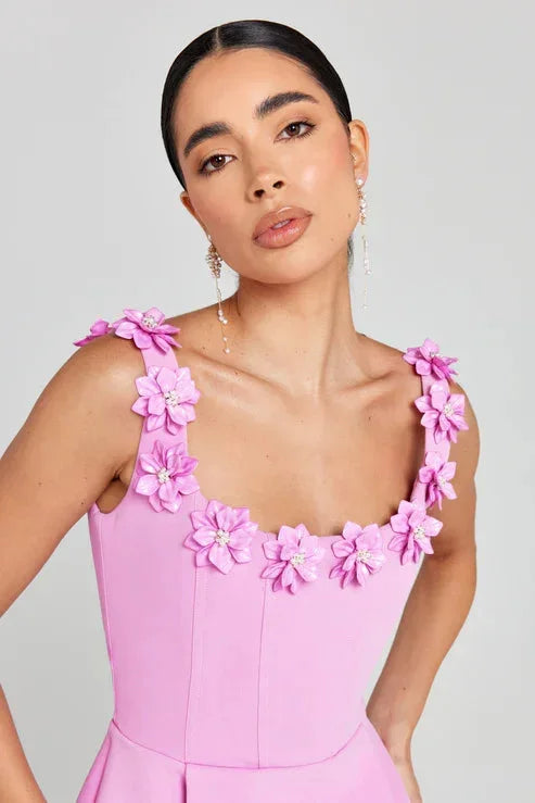 "Sleeveless pink dress with floral details, made of soft cotton blend fabric, perfect for a casual chic look."