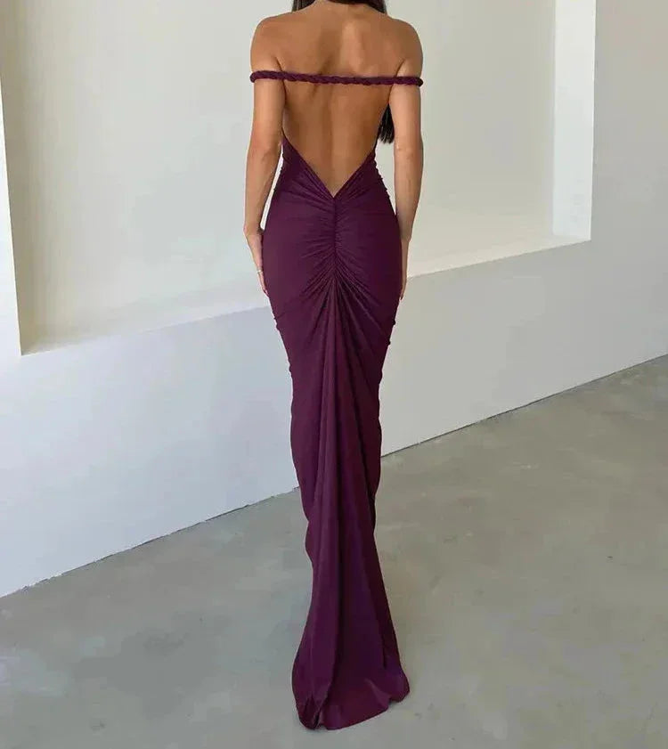 Purple slim-fit maxi dress with spaghetti straps, ideal for a casual day out. Made from soft, flowy fabric with a simple yet…