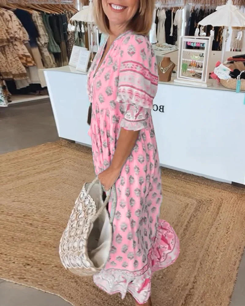 "Boho midi dress with tassel ties, in a breezy and stylish design, perfect for casual outings or beach days by Swayzie."