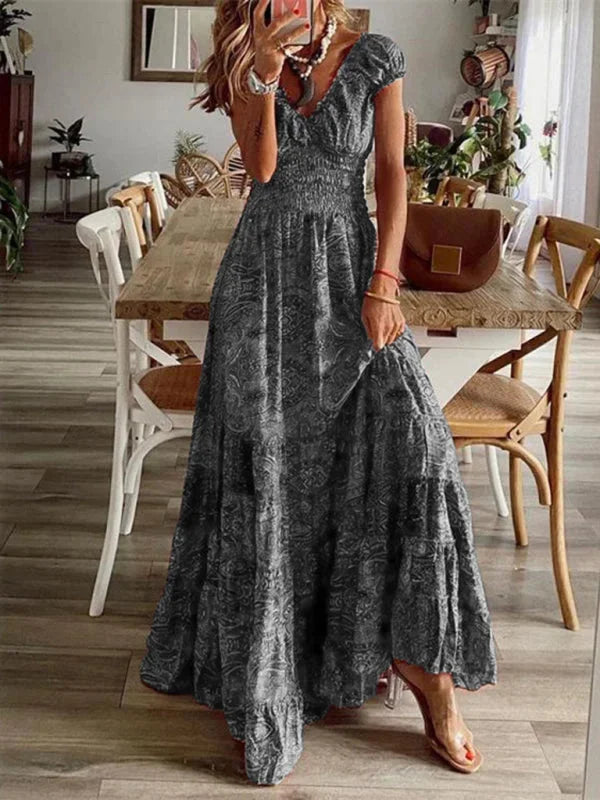 "Aiyla V-neck maxi dress in bohemian style with tiered design, ideal for a casual-chic look with comfortable fabric."