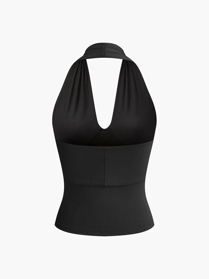 Sleek halter crossover top in Rhythm, made from smooth satin fabric with a chic asymmetric design.