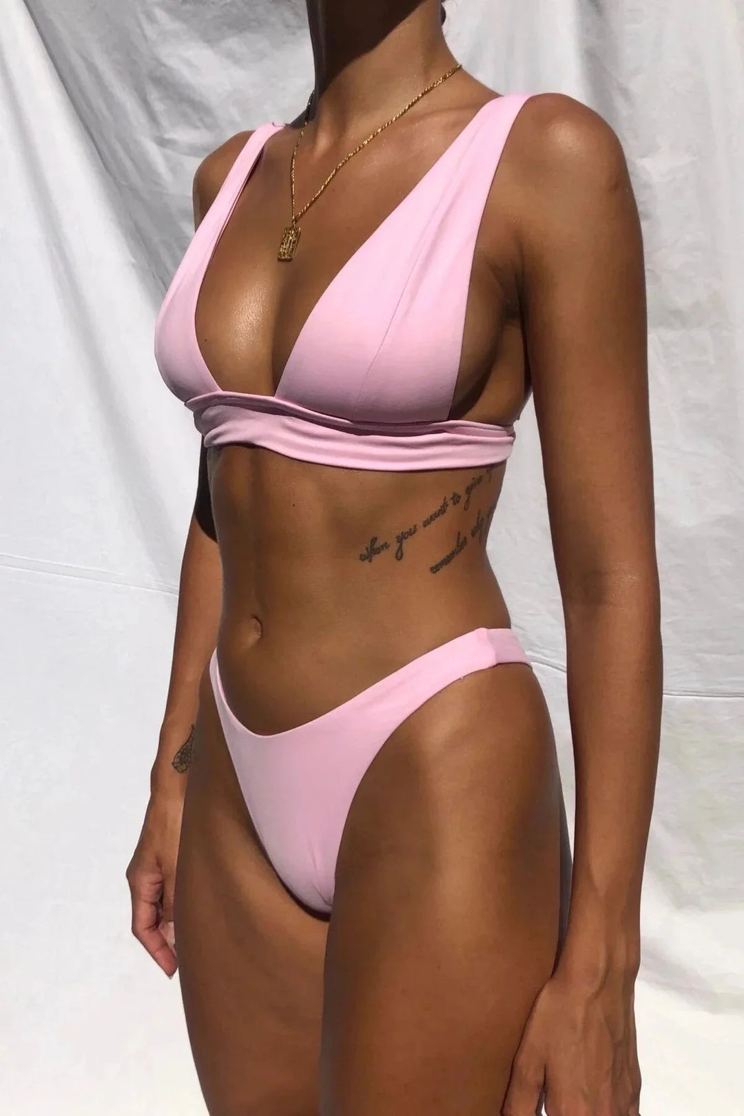 Wynonna push-up bikini set in black with high-rise bottoms, featuring ribbed fabric and adjustable straps for a flattering…