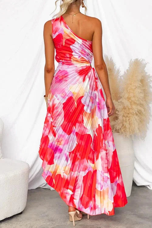 Asymmetric neckline floral maxi dress made of flowy fabric with a striking design and feminine silhouette.