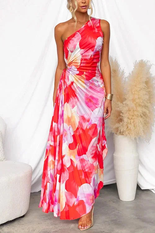 Red pink floral maxi dress with an asymmetric neckline. Features a flowy design with a touch of elegance, perfect for a…