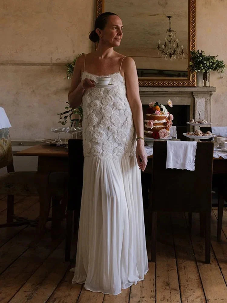 "Sleeveless lace top maxi dress with elegant design, perfect for special occasions. Features intricate lace details and…