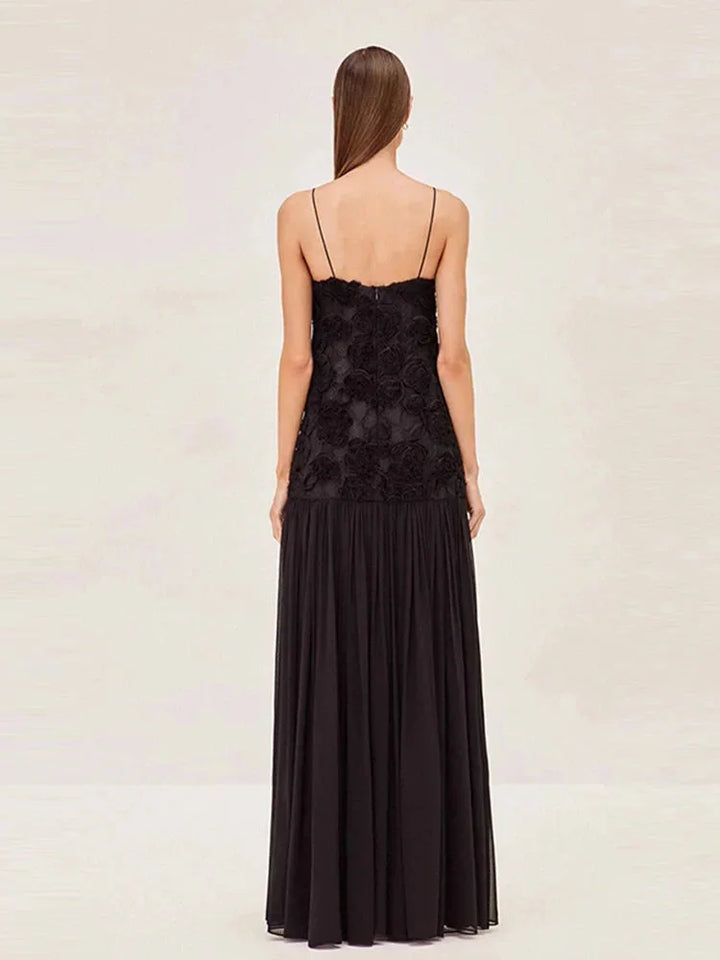 Sleeveless lace top maxi dress with intricately designed lace detailing and flowing silhouette by Amanda.