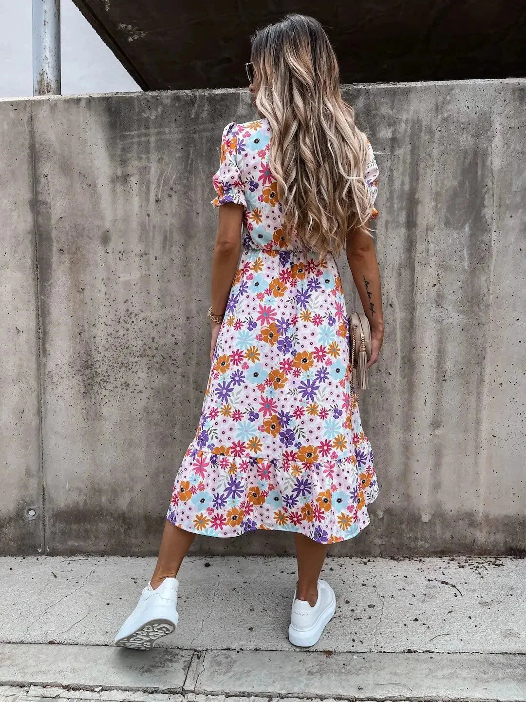 Floral-print midi dress with wrap front detail, featuring vibrant colors and elegant design by Kasandra.