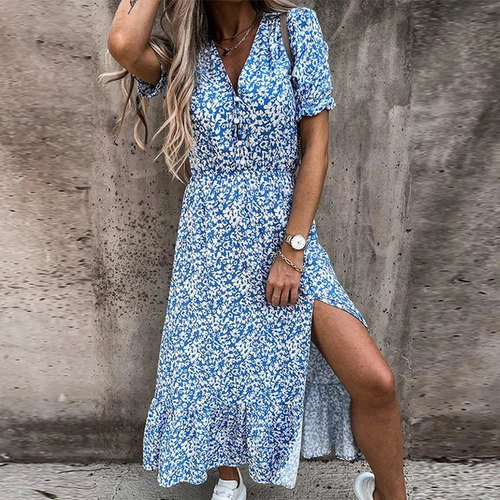 Blue floral midi dress with wrap front by Kasandra. Made with comfortable and breathable fabric, perfect for casual or formal…
