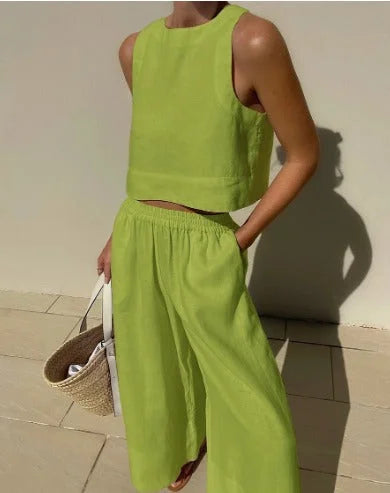 Green sleeveless top and flowing pants set named Amber. Made from soft and breathable fabric, ideal for summer days or…