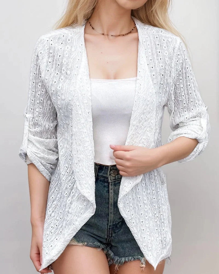White cropped cardigan in textured fabric with an open-front design by Zelena.