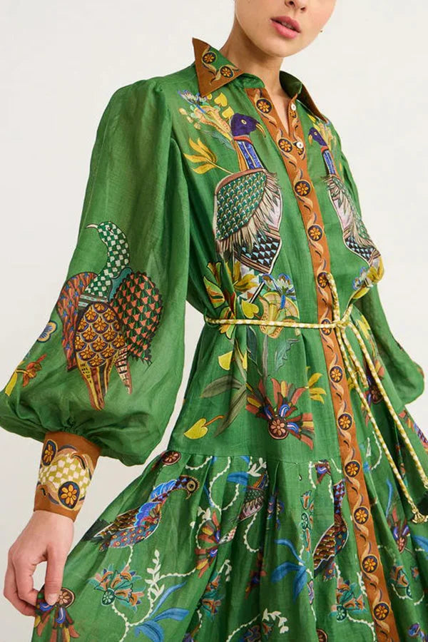 "Kaylie green midi dress featuring charming bird print with flutter sleeves, perfect for adding whimsical flair to your…