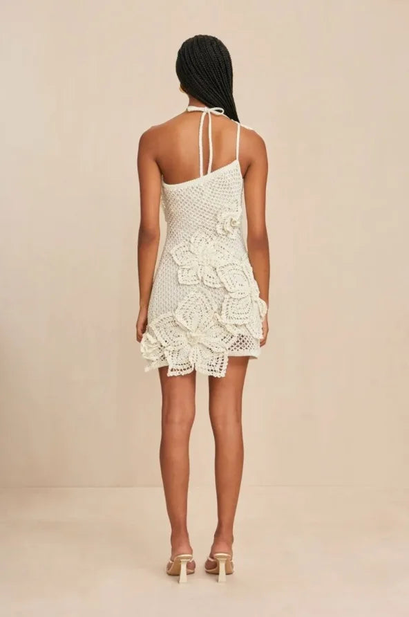 "Off-shoulder white crochet dress showcasing intricate crochet details and a flattering silhouette by Rayla."