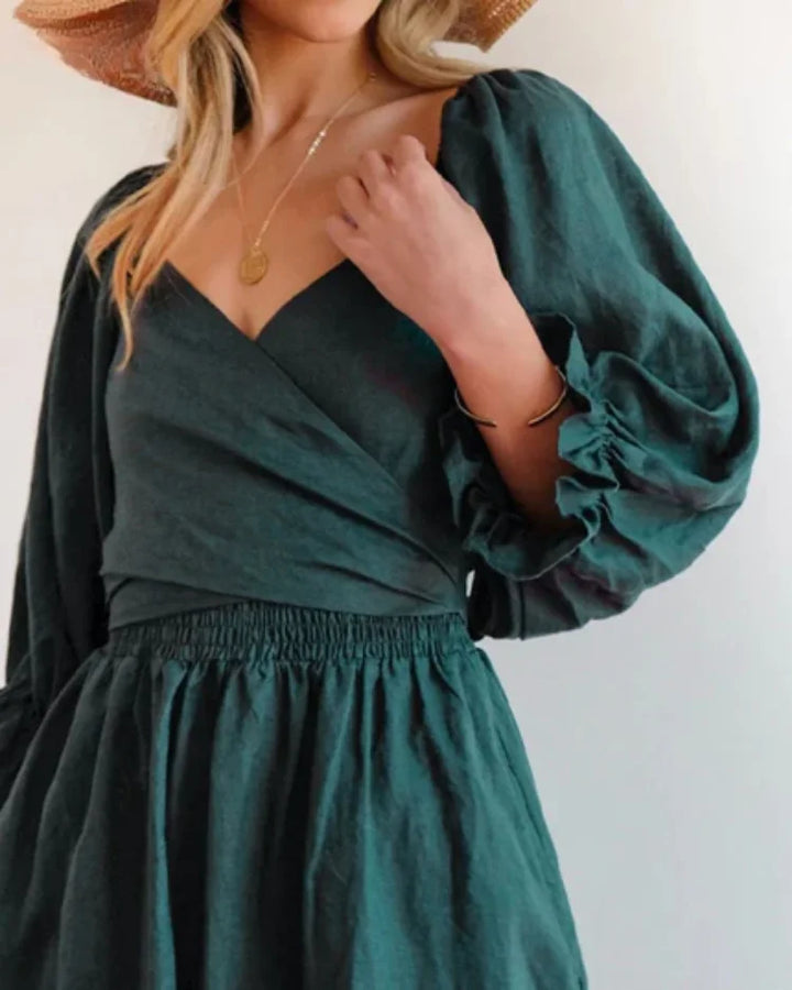 Jessi wrap dress in black jersey fabric with deep V-neck, perfect for a casual chic look.