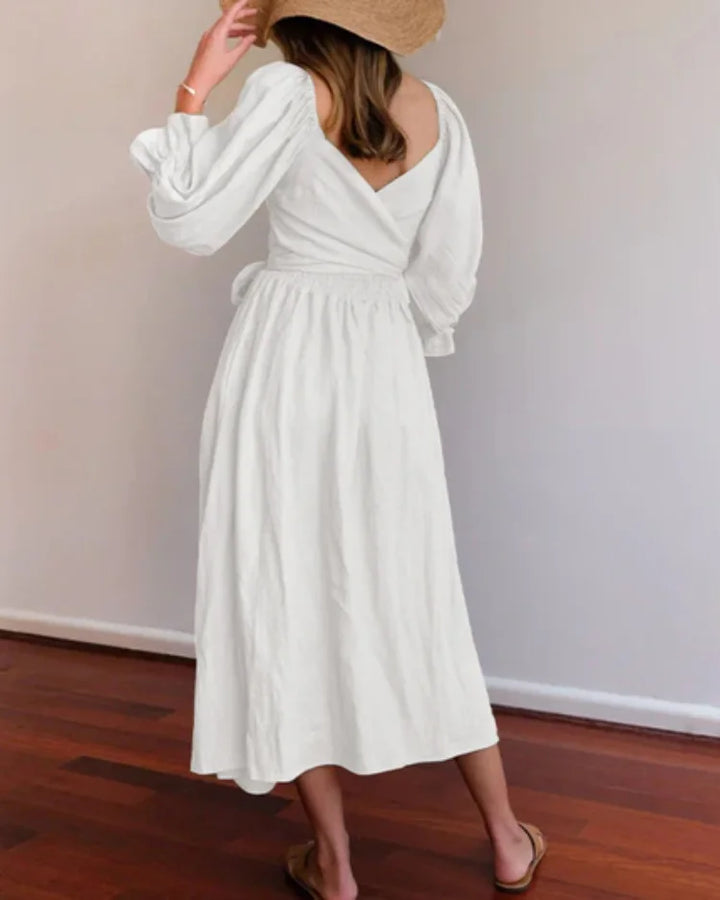 Chic wrap dress in soft, flowy fabric with a flattering deep V-neckline design by Jessi.