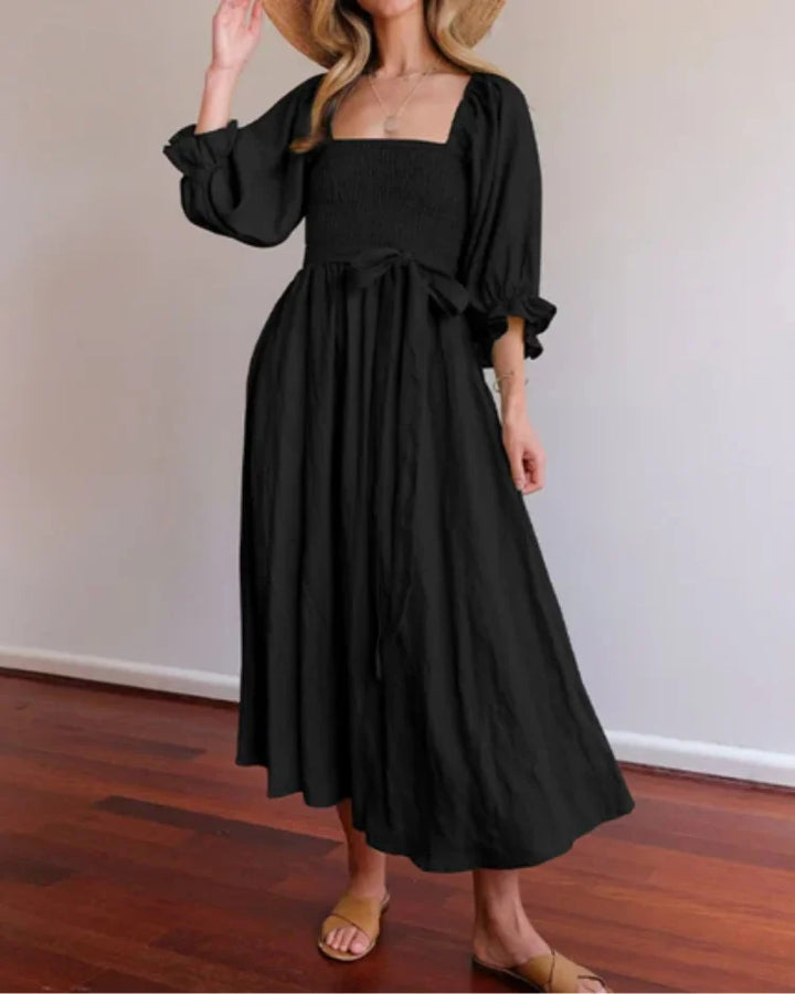 Black wrap dress with deep V-neckline by Jessi. Made of soft polyester blend. Stylish and versatile must-have for your…