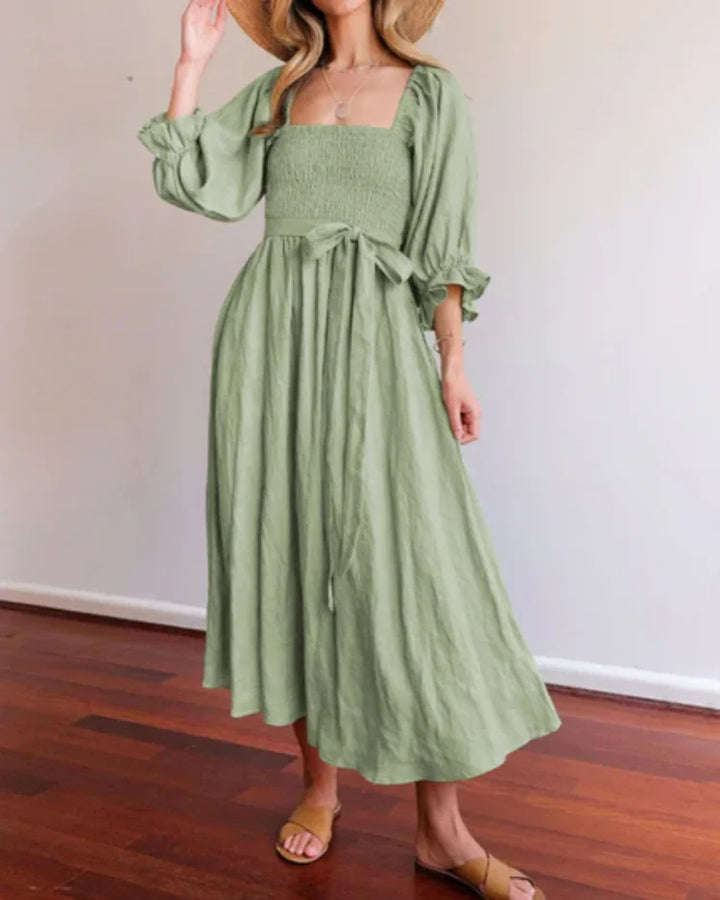 Green wrap dress with deep V-neckline by Jessi. Made of soft and flowy fabric, perfect for casual outings or special…