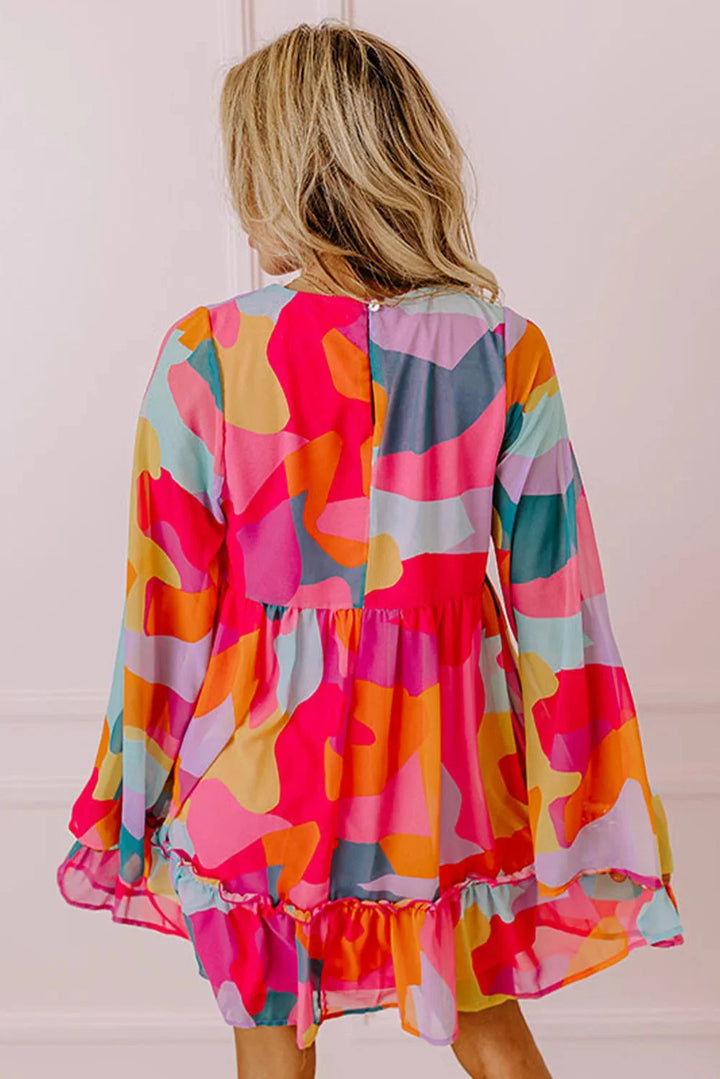 Karson babydoll dress with vibrant print and V-neck, perfect for a casual chic look.