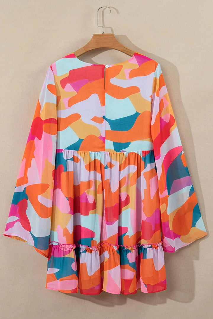 Vibrant printed V-neck babydoll dress by Karson with a flowy silhouette, perfect for casual outings.