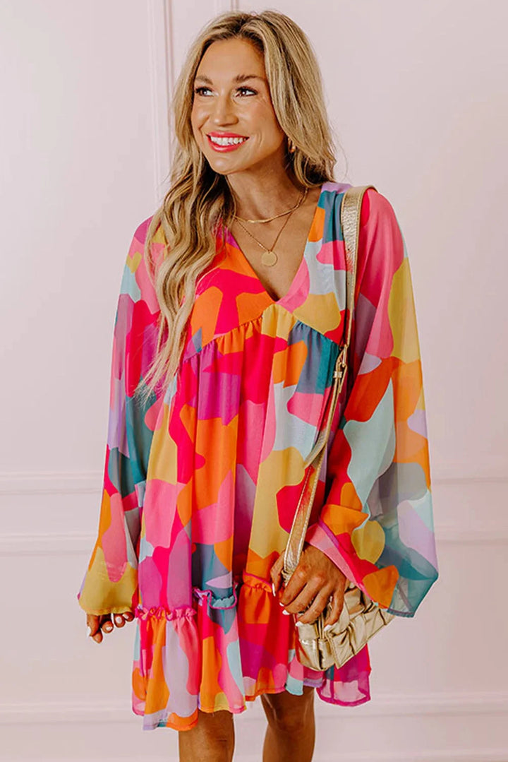 Bright and playful, Karson babydoll dress in a vibrant print with a flattering V-neck design for a casual yet chic look.