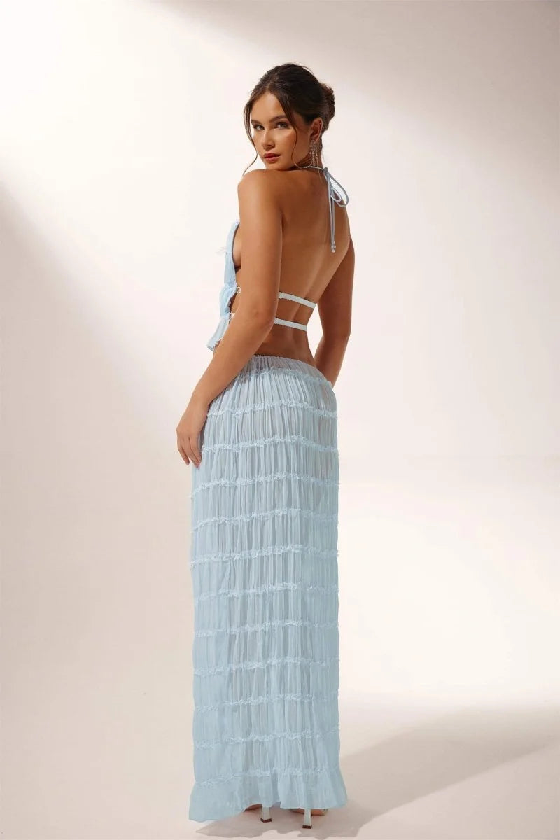 Light blue pleated halter crop top and skirt set with a flowy design, perfect for a casual yet stylish look.