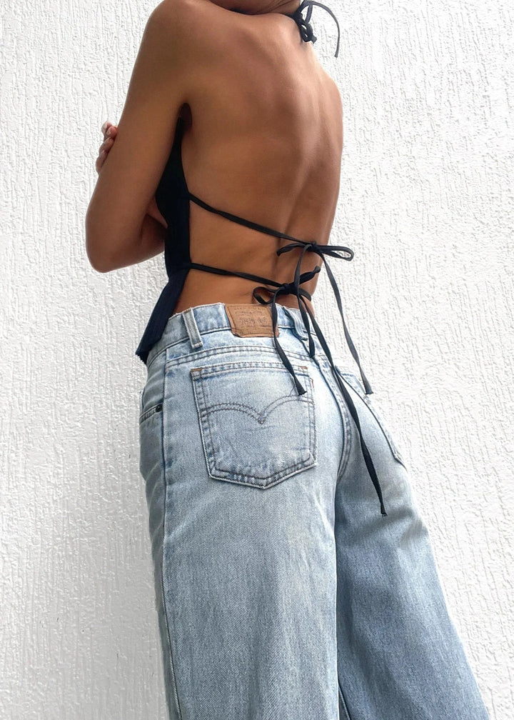 Black halter top showcasing metallic chain detailing and a stylish design by Avi for women.