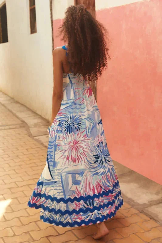 Kirra sleeveless maxi dress with wave trim in a flowing, lightweight fabric, perfect for a casual summer day out.