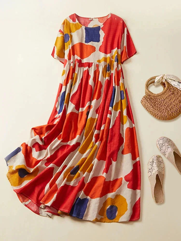 "Short sleeve maxi dress featuring a unique print design, ideal for casual outings or gatherings."