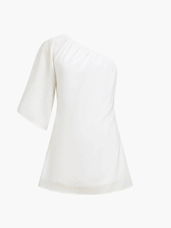 "Off-shoulder mini dress in Kendal, featuring puff sleeves and a flattering silhouette, perfect for a chic and stylish look."
