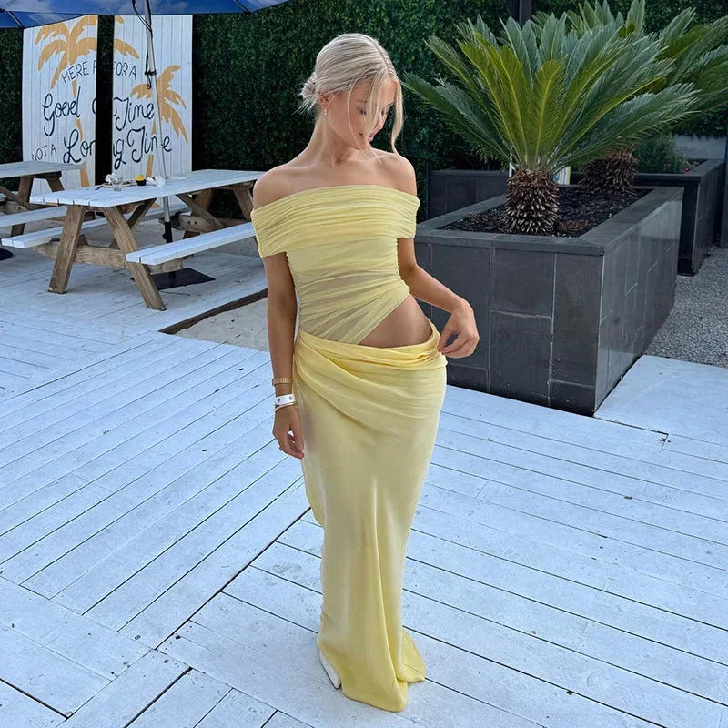 Yellow off-shoulder maxi dress with waist cut-out. Ruched detailing on lightweight fabric, perfect for a summer day out.
