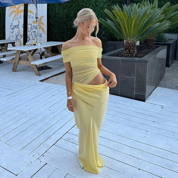 Yellow off-shoulder maxi dress with waist cut-out. Ruched detailing on lightweight fabric, perfect for a summer day out.