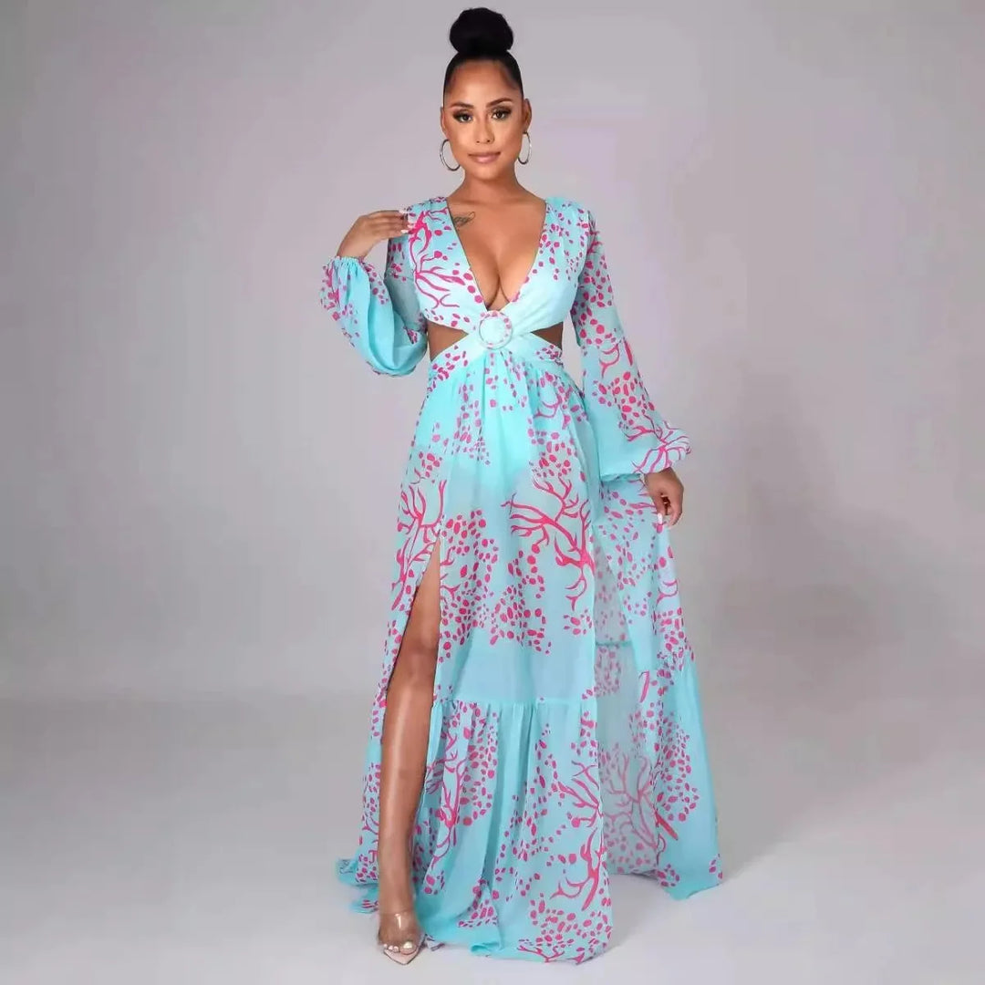 "Indica Long-sleeved deep-V maxi dress in Print 1, features a bold and vibrant print with a plunging neckline and flowy…