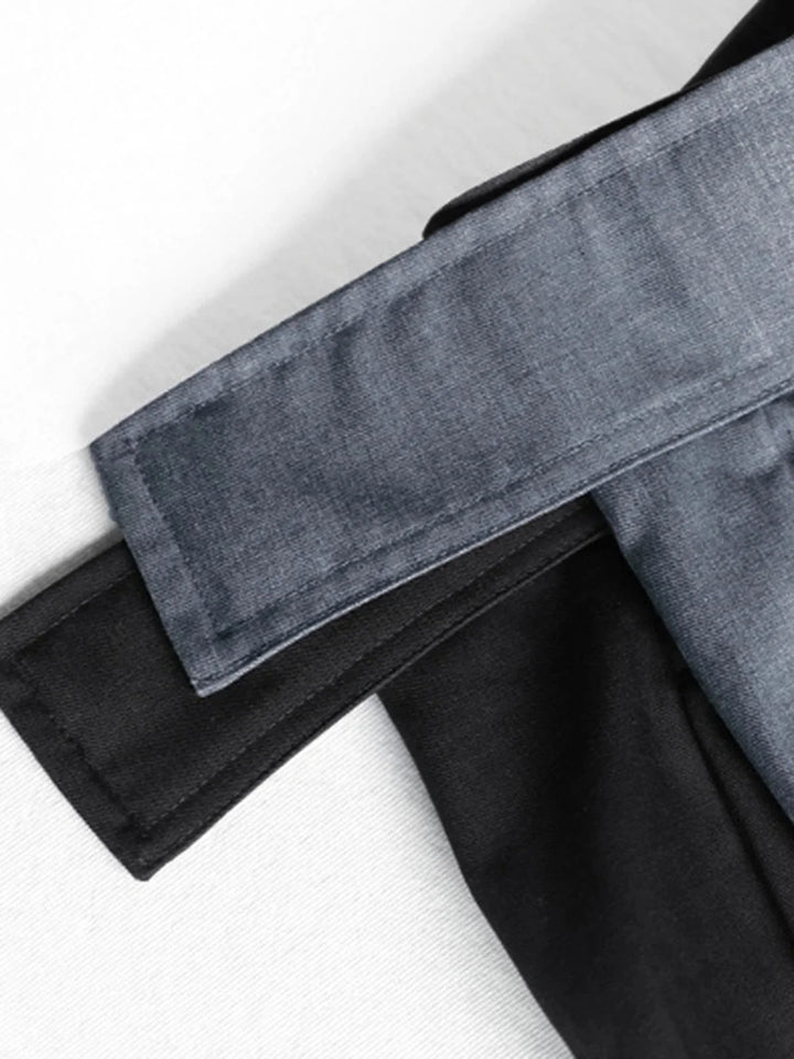Black wide-leg pants with adjustable fit from Adelyne. Made of soft, stretchy fabric. Side pockets and elastic waist for…