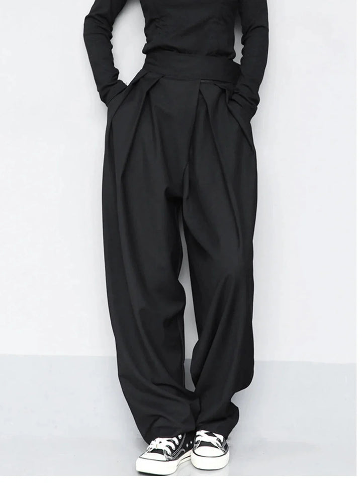 Black wide-leg pants with adjustable fit. Made from comfortable and durable fabric. Perfect for everyday wear with a classic…